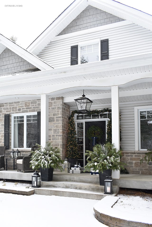 Set a magical scene and welcome your guests on your Christmas front porch this year with fresh greenery and the twinkle of white lights.