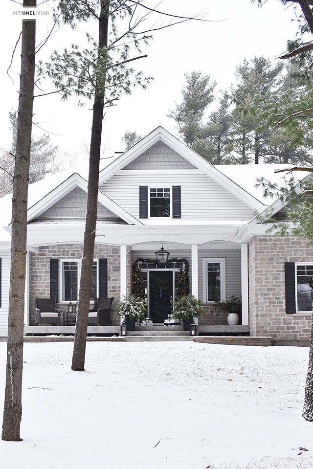 Set a magical scene and welcome your guests on your Christmas front porch this year with fresh greenery and the twinkle of white lights.