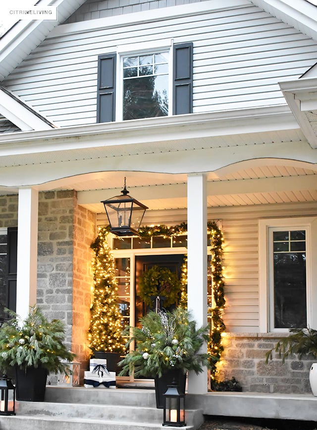 Set a magical scene and welcome your guests on your Christmas front porch this year with fresh greenery and the twinkle of white lights.