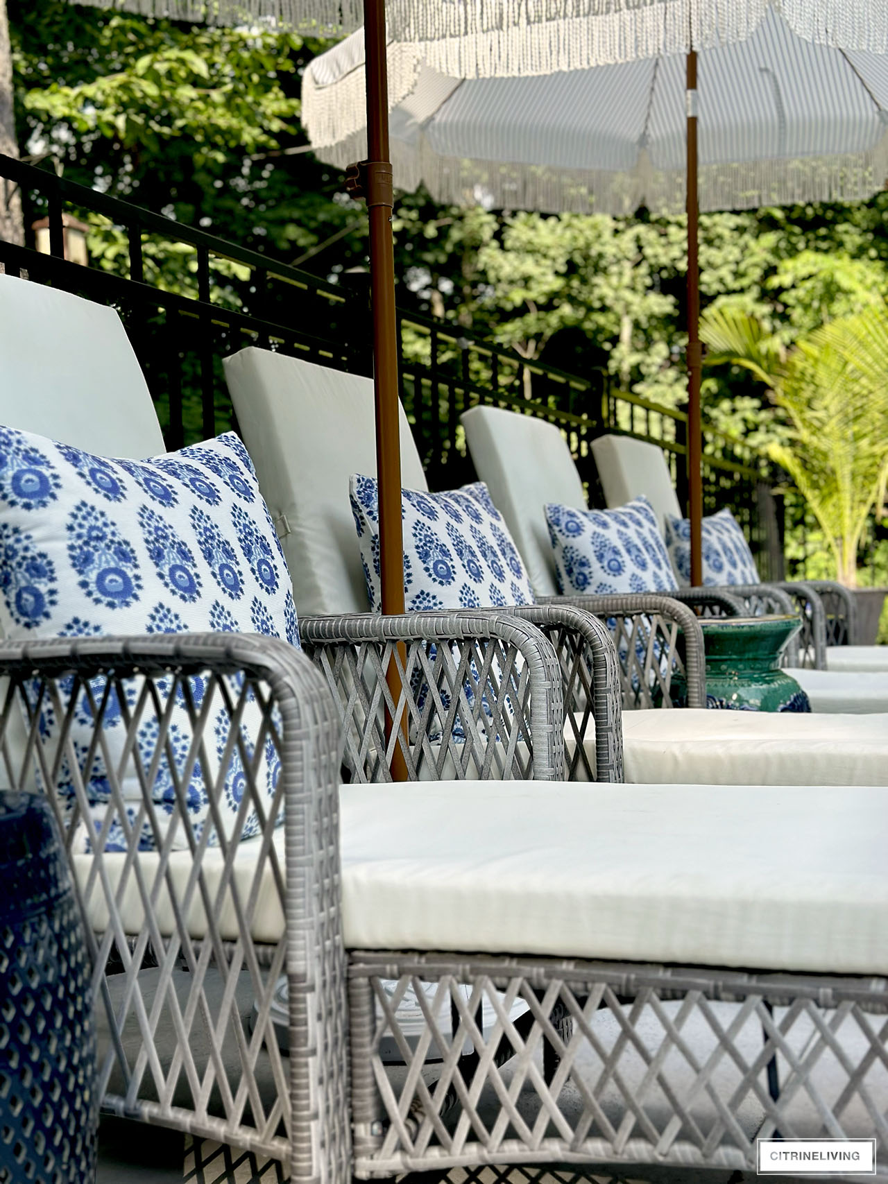 Pool loungers and batik print pillows in blue and white.