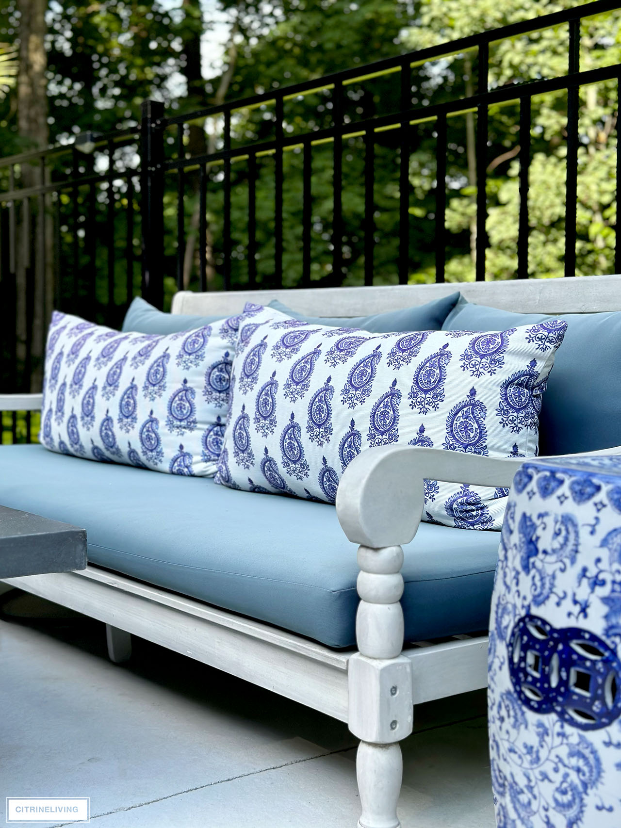 Outdoor daybed with lumbar pillows in batik print.