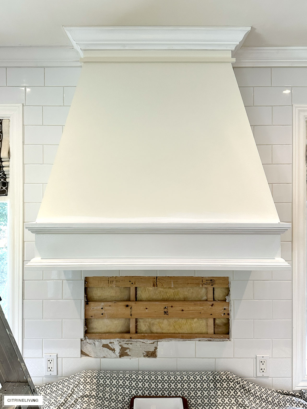 Ivory range hood with trim painted white