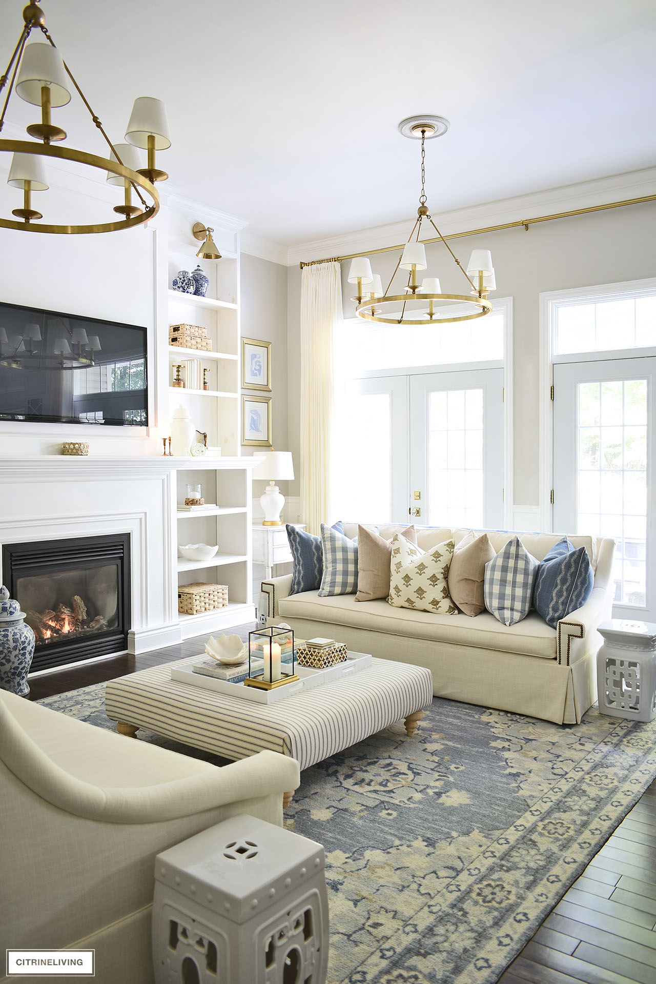 Fall living room decorated with a blue, brown, ivory palette with gold accents
