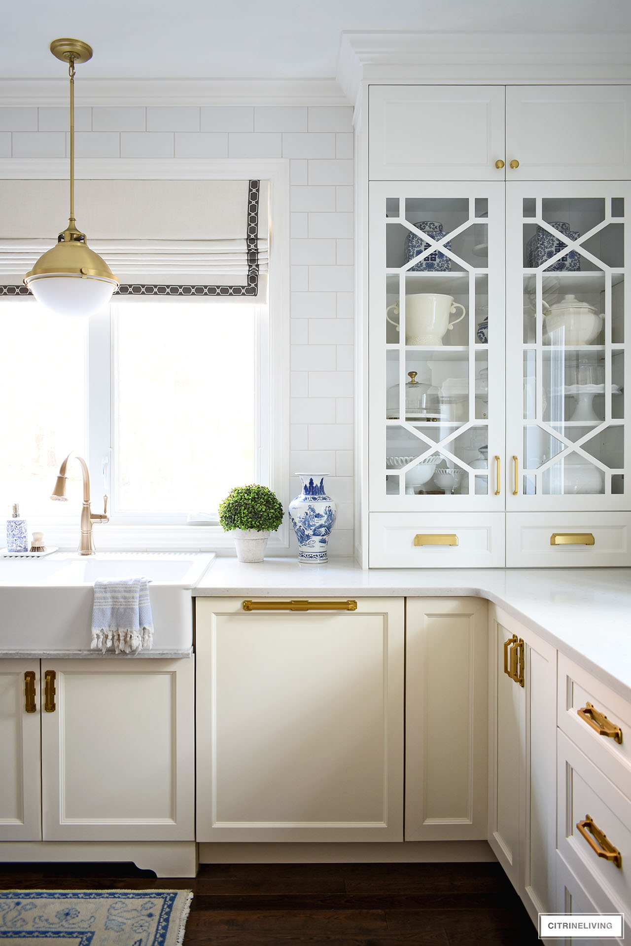 white kitchen with custom glass cabinets