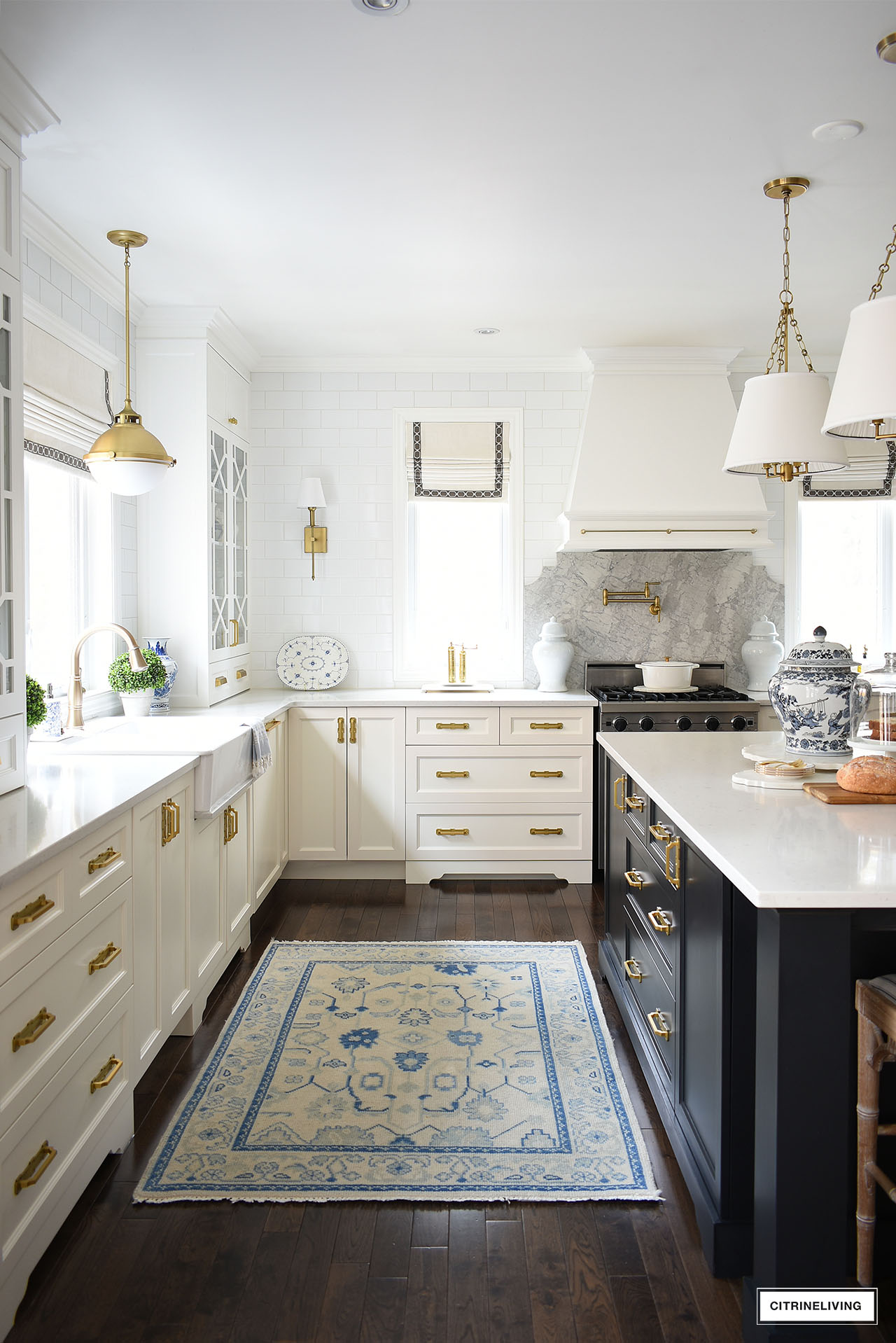 Traditional white kitchen with a black island