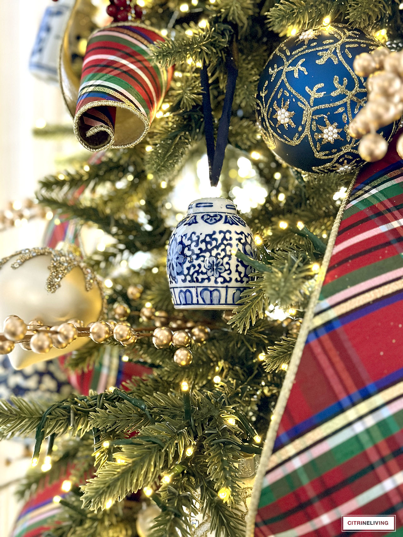 Ginger jar Christmas tree ornament hanging on a tree