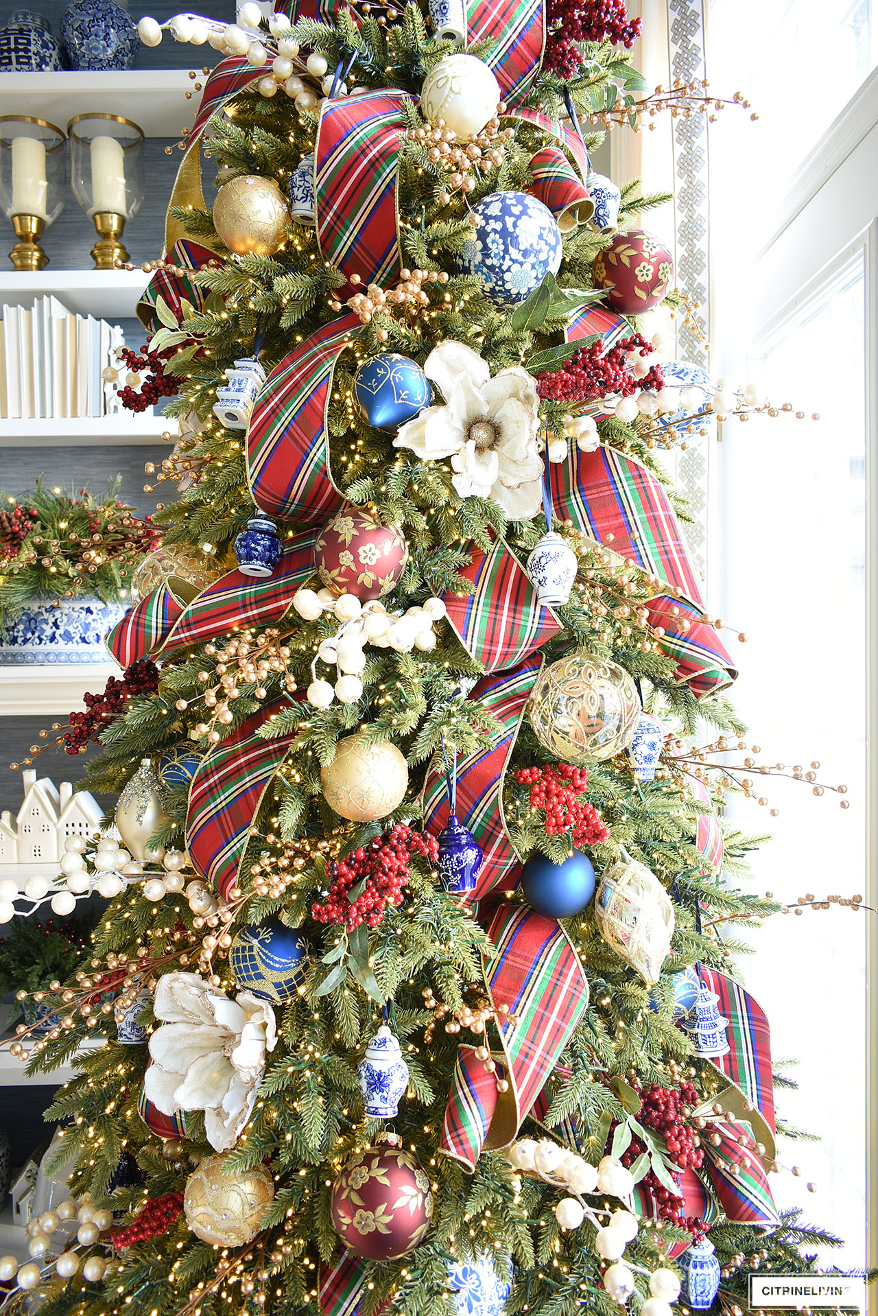 Christmas tree decorated in red, white, blue and gold.