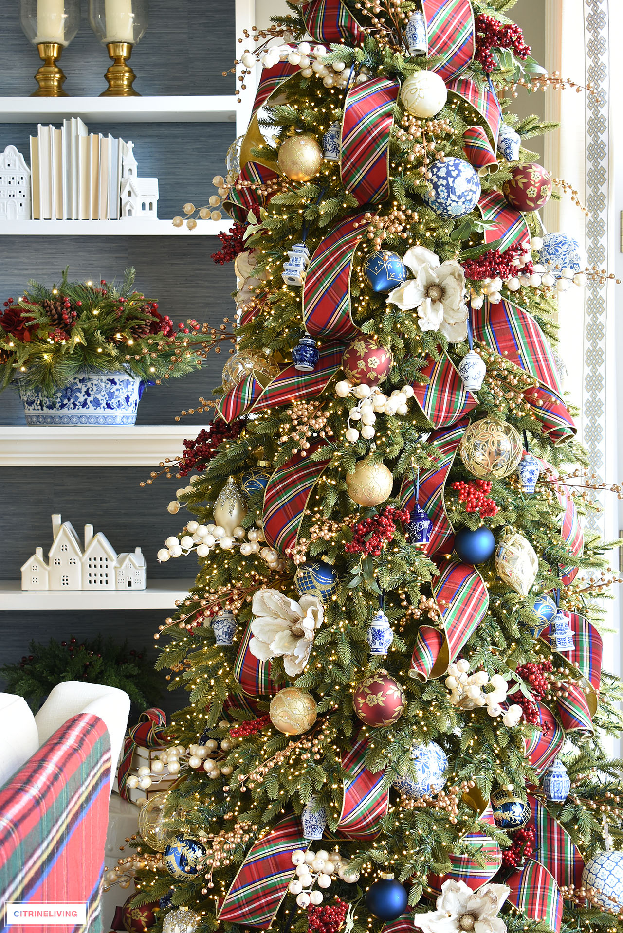 Christmas tree decorated in red, white, blue and gold.