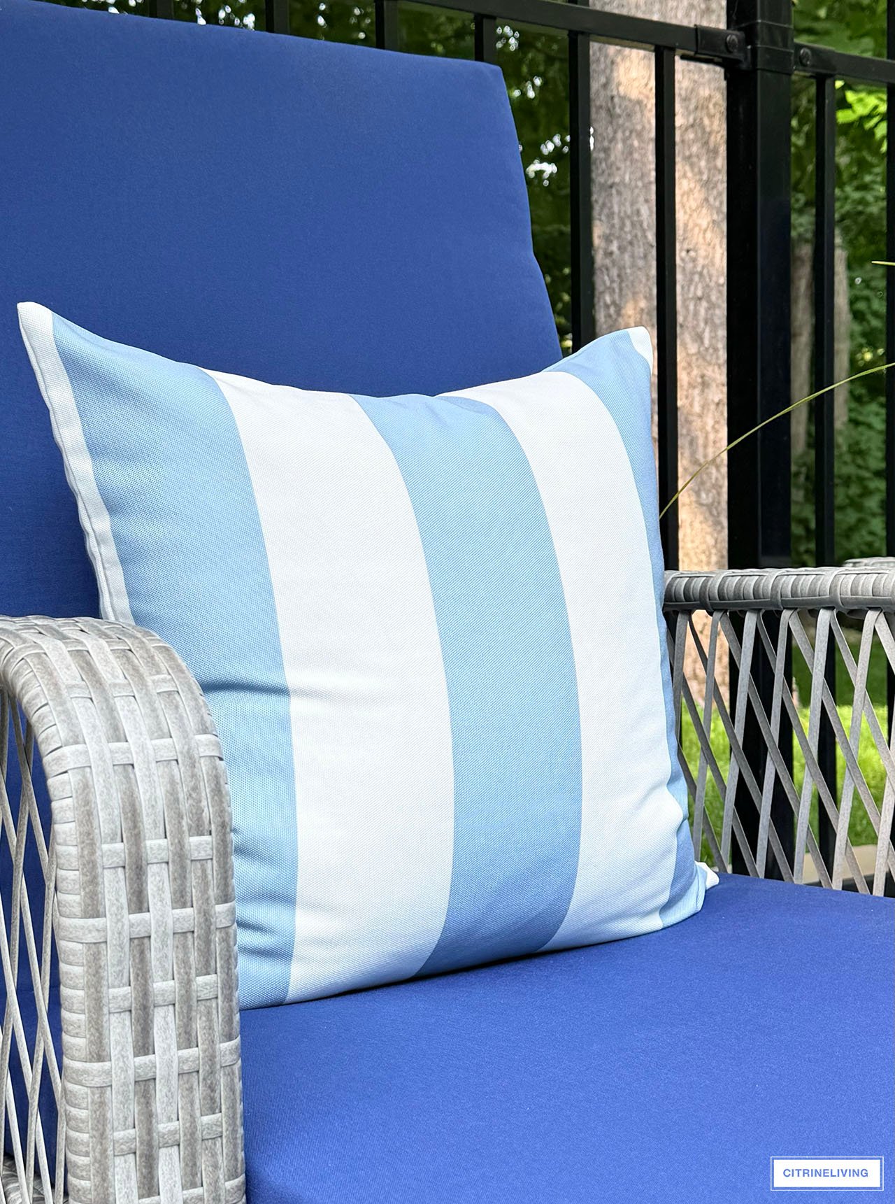 Striped blue and white outdoor pillow